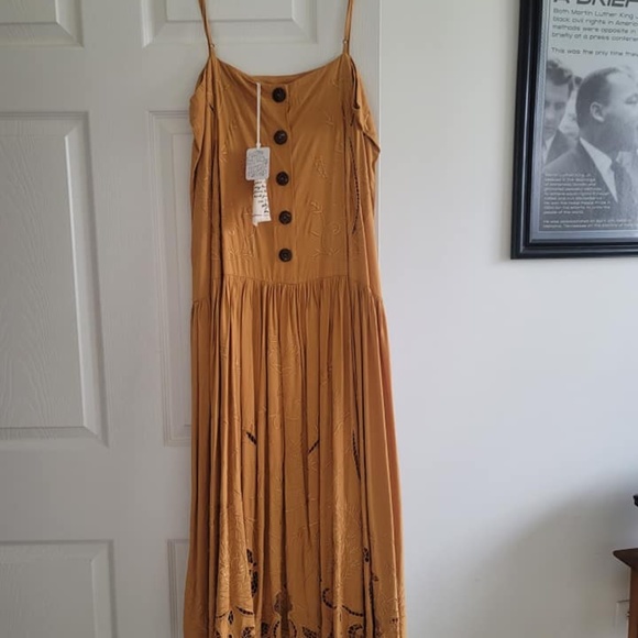 Never worn ..Peasant Dress by Free People...It is calling YOUR name. - Picture 2 of 3